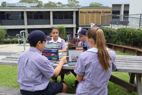 Student making the most of technology in our outdoor spaces